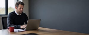 A UK infrastructure or utilities professional reviewing engagement records 