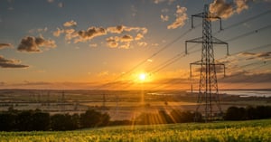 electricity poles and wires in open field